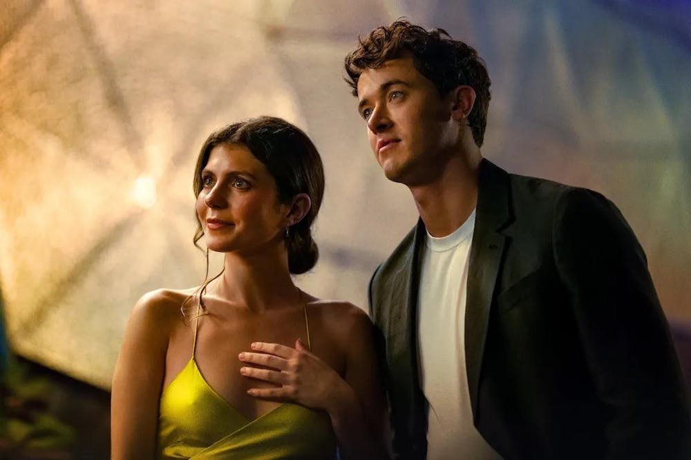 Two people stare into distance.