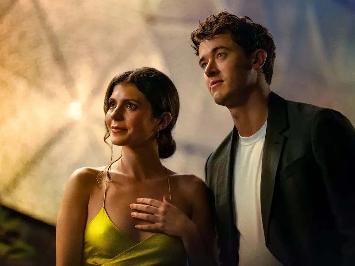 Two people stare into distance.