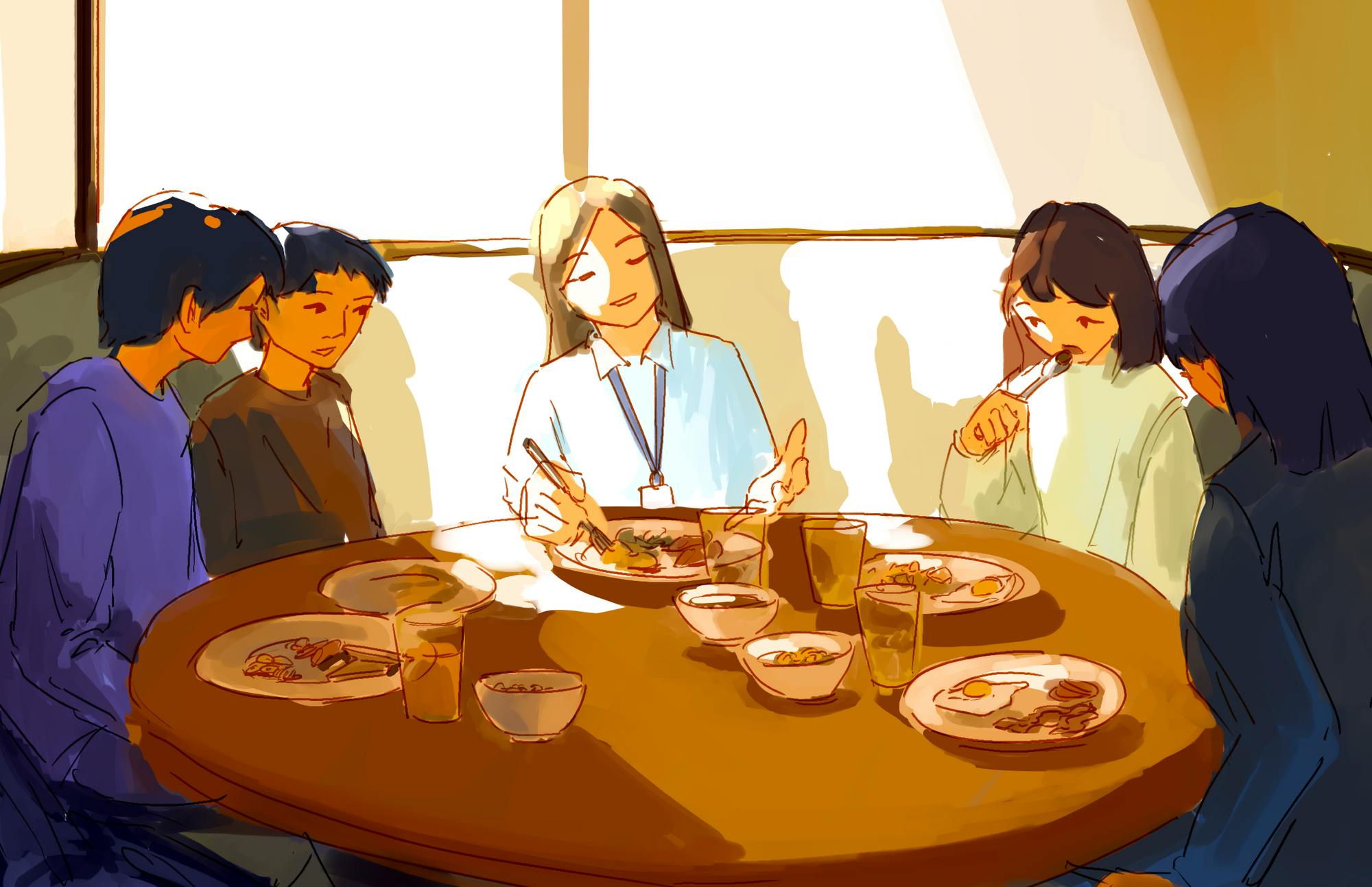 A professor and students eating breakfast at a table together.