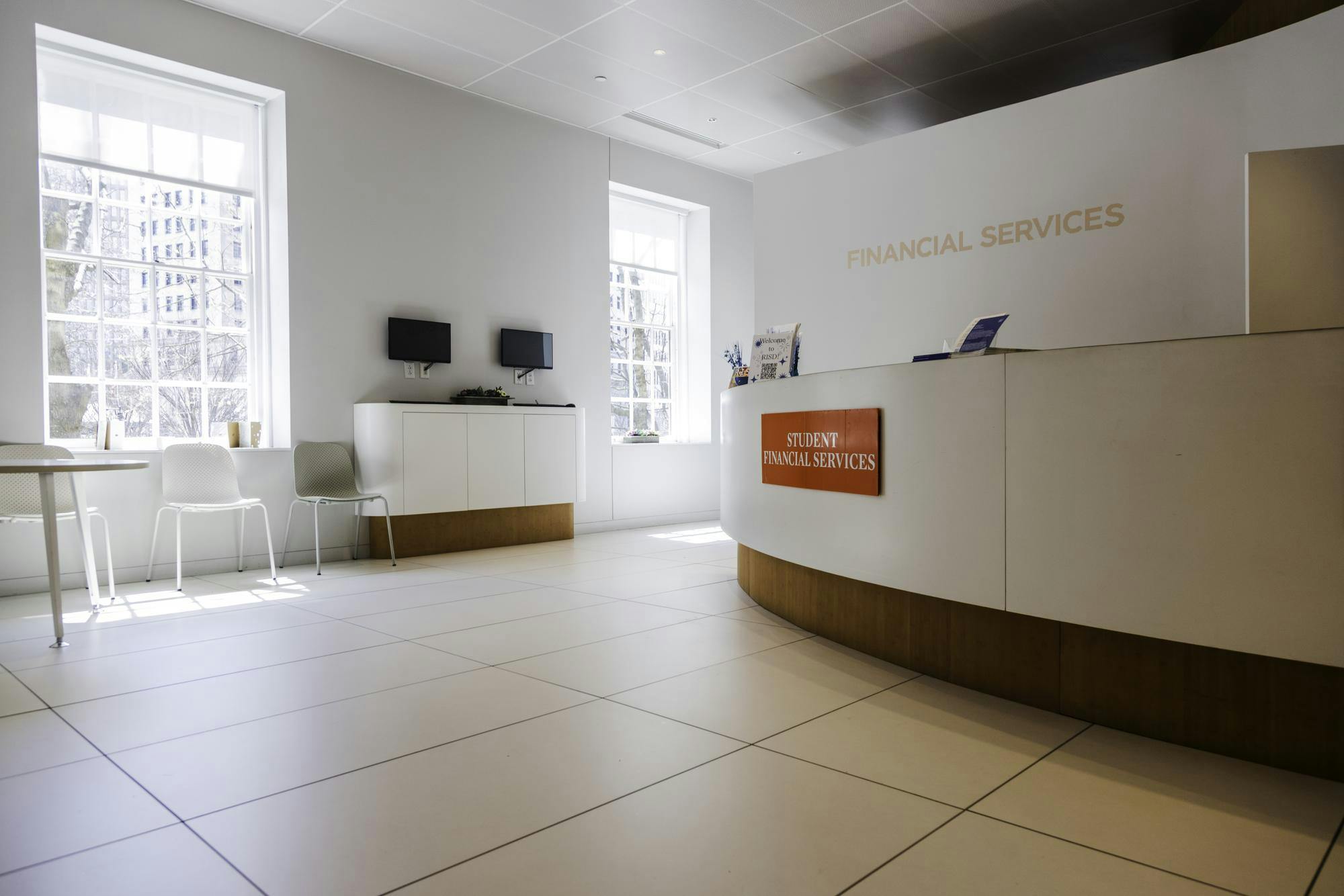 A photograph of the interior lobby of the RISD student financial services office.