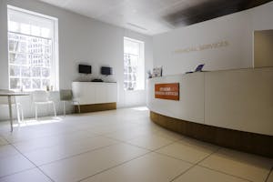 A photograph of the interior lobby of the RISD student financial services office.