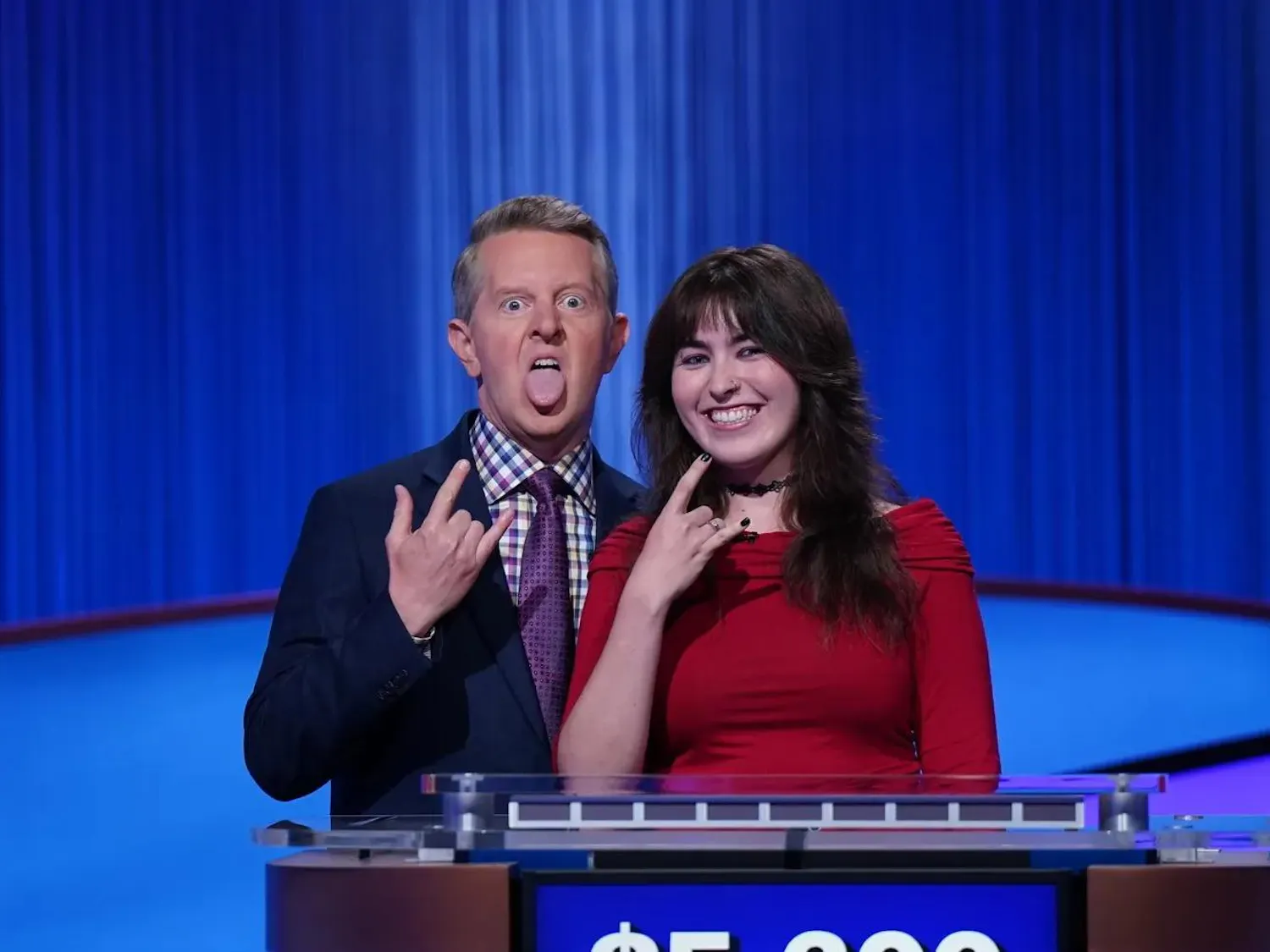 Photograph of Delaney O'Dea ’28 and "Jeopardy!" host Ken Jennings posing together on the set of "Jeopardy!"