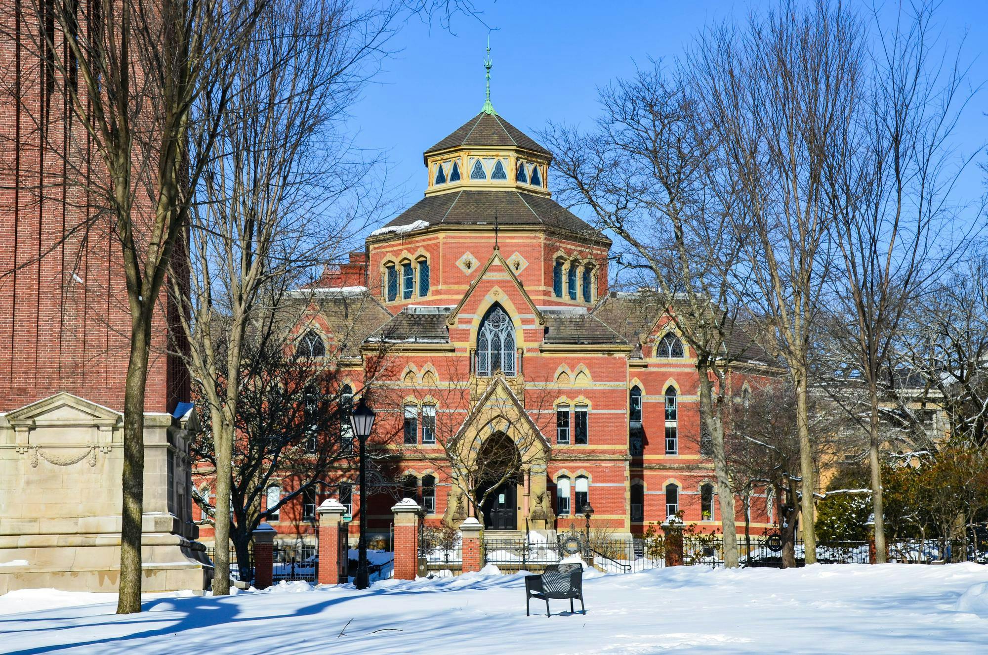 A photo of the economics building from the Quiet Green, covered in snow in February. 
