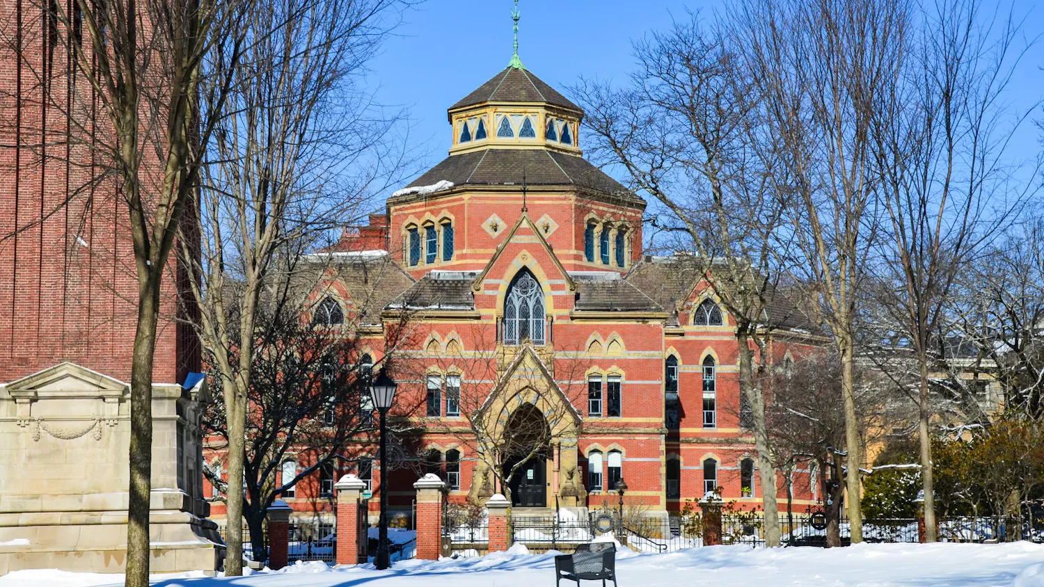 A photo of the economics building from the Quiet Green, covered in snow in February.