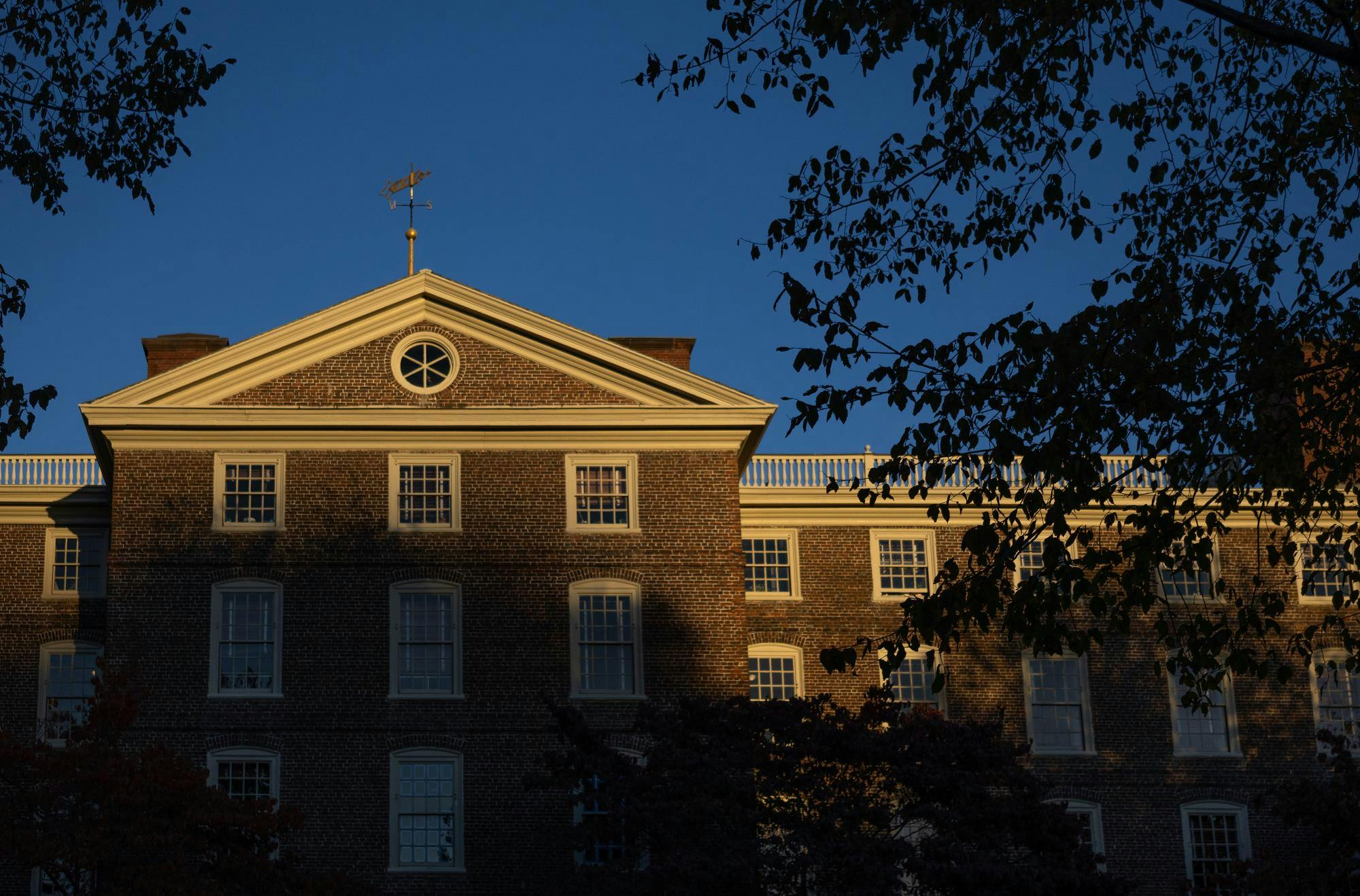 A photo of University Hall bathed in late afternoon light.