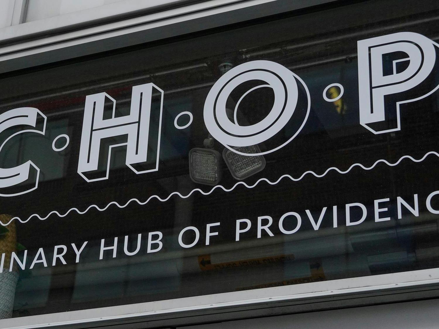 A picture of the CHOP logo on glass. Below the CHOP letters, the letters read "Culinary Hub of Providence."