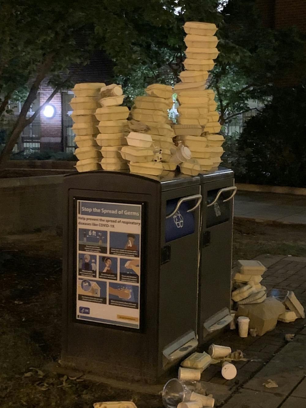 <p>Cafeteria boxes pile on top of trash cans follow the Sept. 13 halt of all in-person dining  due to an uptick in COVID-19 cases at Brown.</p>