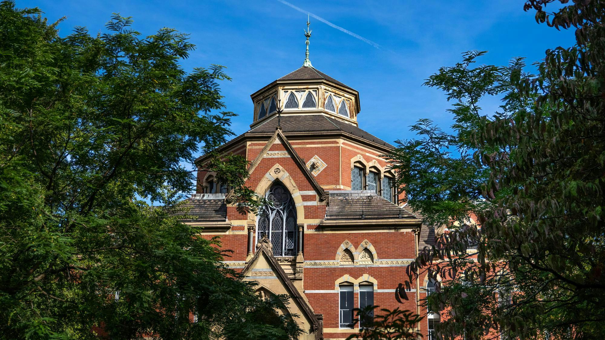Photo of Robinson Hall, a venetian gothic red-brick building which houses Brown University’s Department of Economics.