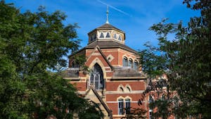 Photo of Robinson Hall, a venetian gothic red-brick building which houses Brown University’s Department of Economics.