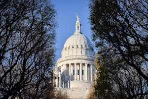 The dome of the Rhode Island State House through trees