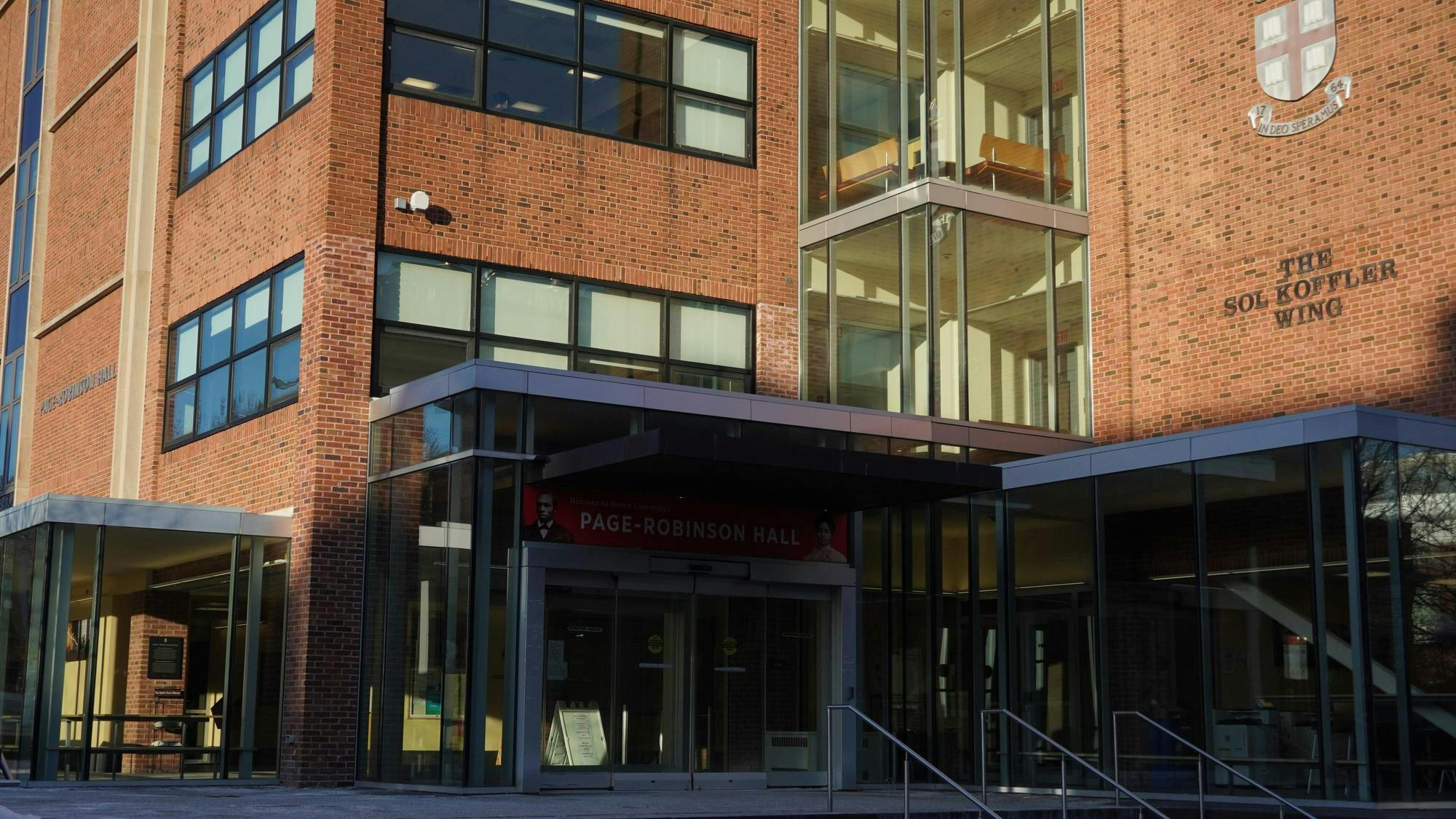 A photograph of Page-Robinson Hall, a brick building with a glass entrance/windows.