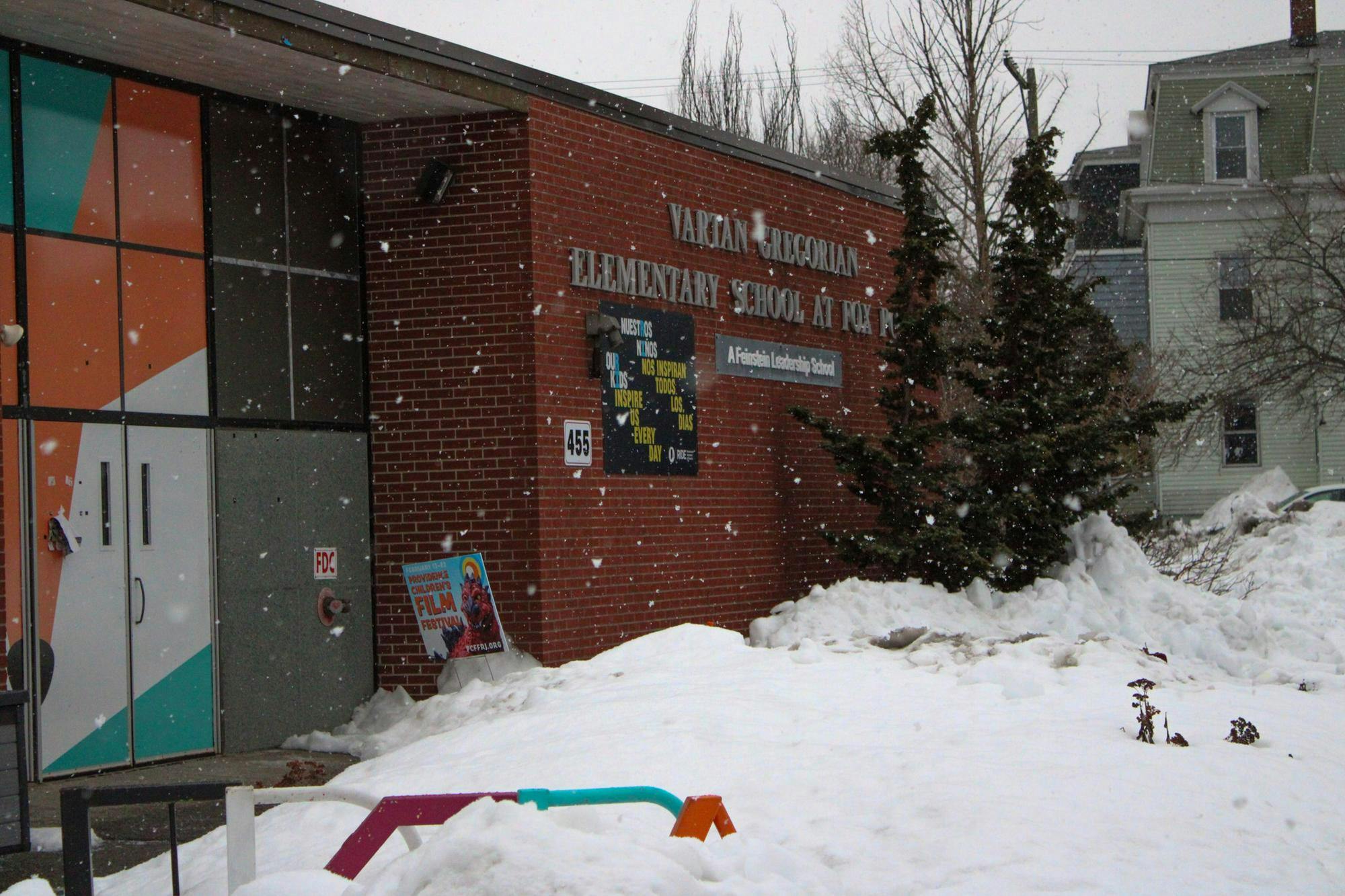 Photo of the Vartan Gregorian Elementary School covered in falling snow.