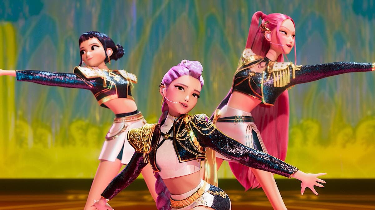 A frame from the movie K-pop Demon Hunters depicting the three lead characters in a dance performance.