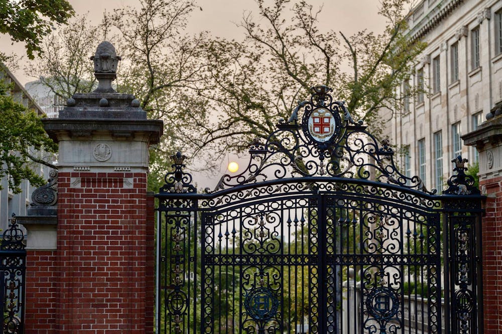 Photo of the Van Wickle gates with the sun setting in the background