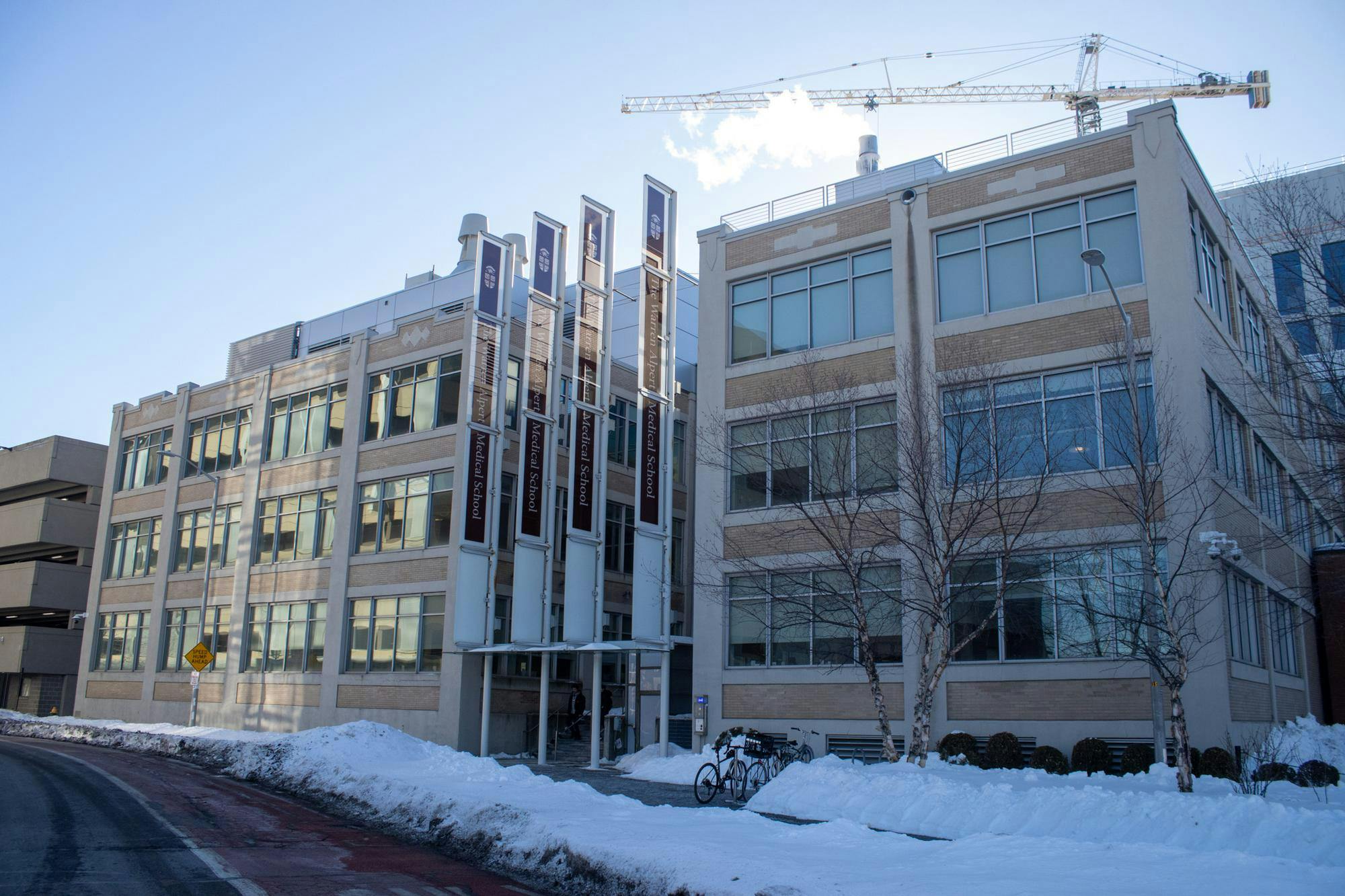 Photo of the Warren Alpert Medical School during a clear day with snow on the ground.