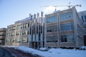 Photo of the Warren Alpert Medical School during a clear day with snow on the ground.