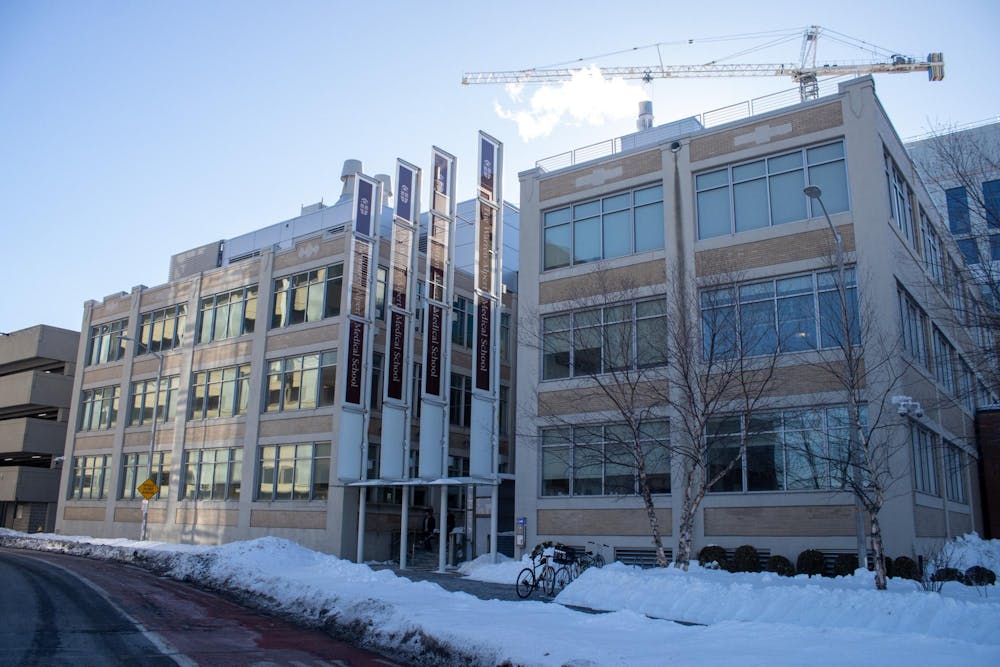 Photo of the Warren Alpert Medical School during a clear day with snow on the ground.