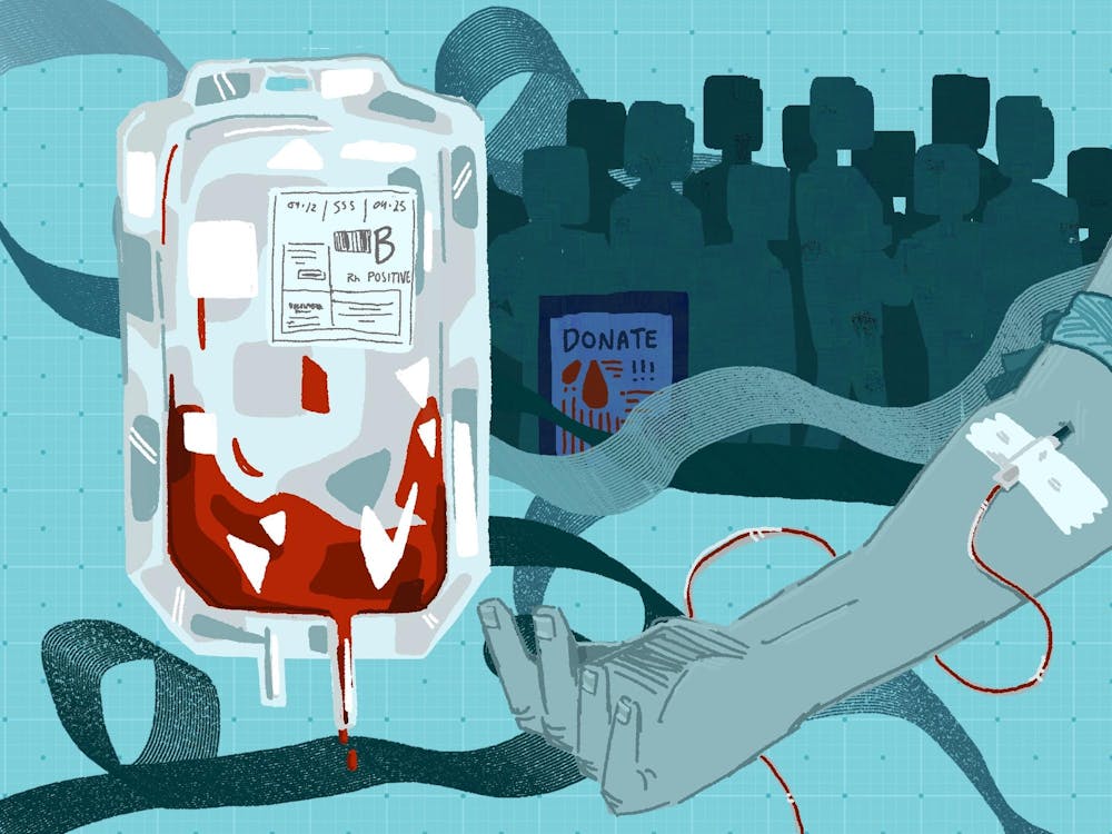 Teal illustration of a person donating their blood. On the left hovers a contrasting red blood bag. 

