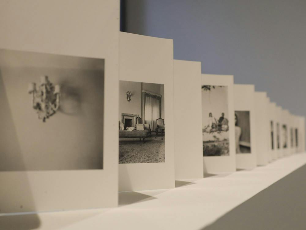 A photo of many cards in a row with black-and-white photos on each card.