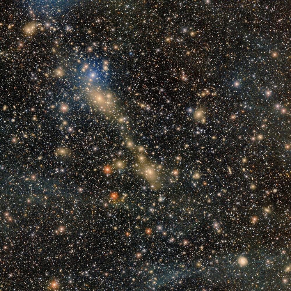 A photo of Abell 3667, an actively merging galaxy cluster, taken by a telescope mounted at Cerro Tololo Inter-American Observatory.