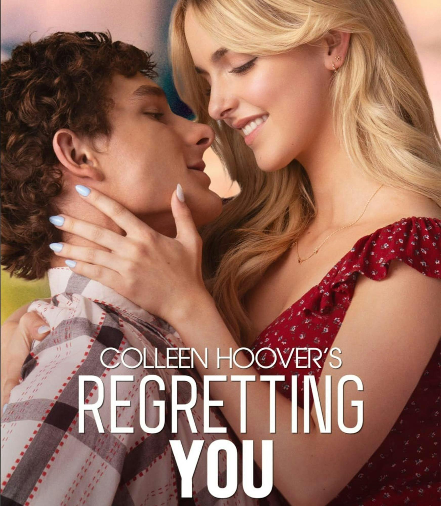 The poster for "Regretting You." McKenna Grace and Mason Thames smiling at each other while in a close embrace.