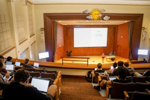 Photo of the Salomon Center for Teaching at Brown University's De Ciccio Family Auditorium during a class, showing students taking notes on their computers.