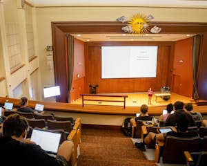 Photo of the Salomon Center for Teaching at Brown University's De Ciccio Family Auditorium during a class, showing students taking notes on their computers.