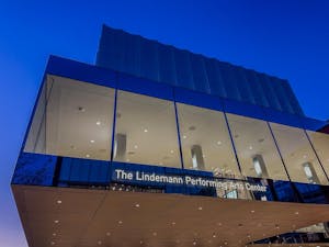 A photo of the Lindemann Performing Arts Center at twilight.