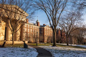 A photo of University Hall from the Quiet Green on a snowy day.