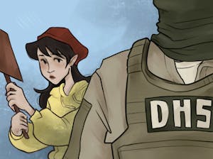 Photo of a person holding up a brown sign peering over the side of a Department of Homeland Security agent.