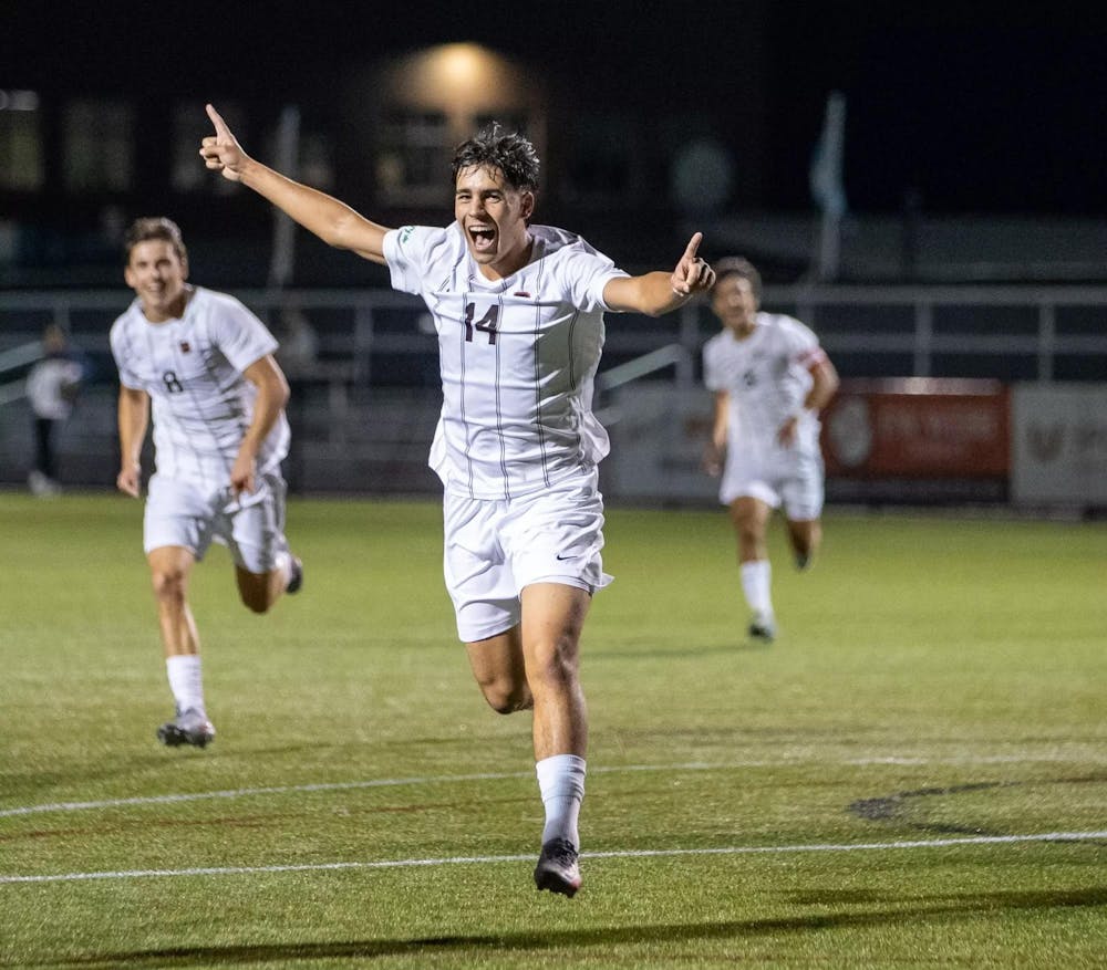 A player celebrating with fingers pointing up.
