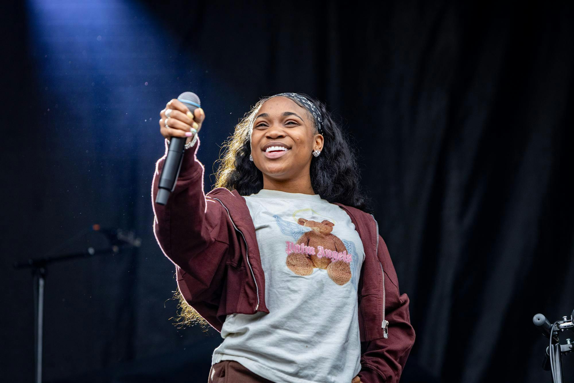 Photo of the musician BunnaB holding a microphone.