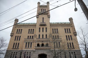 The Cranston Street Armory, a large yellow castle-esque building.