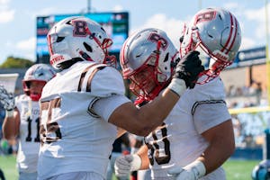 A photo of two Brown football players celebrating. 