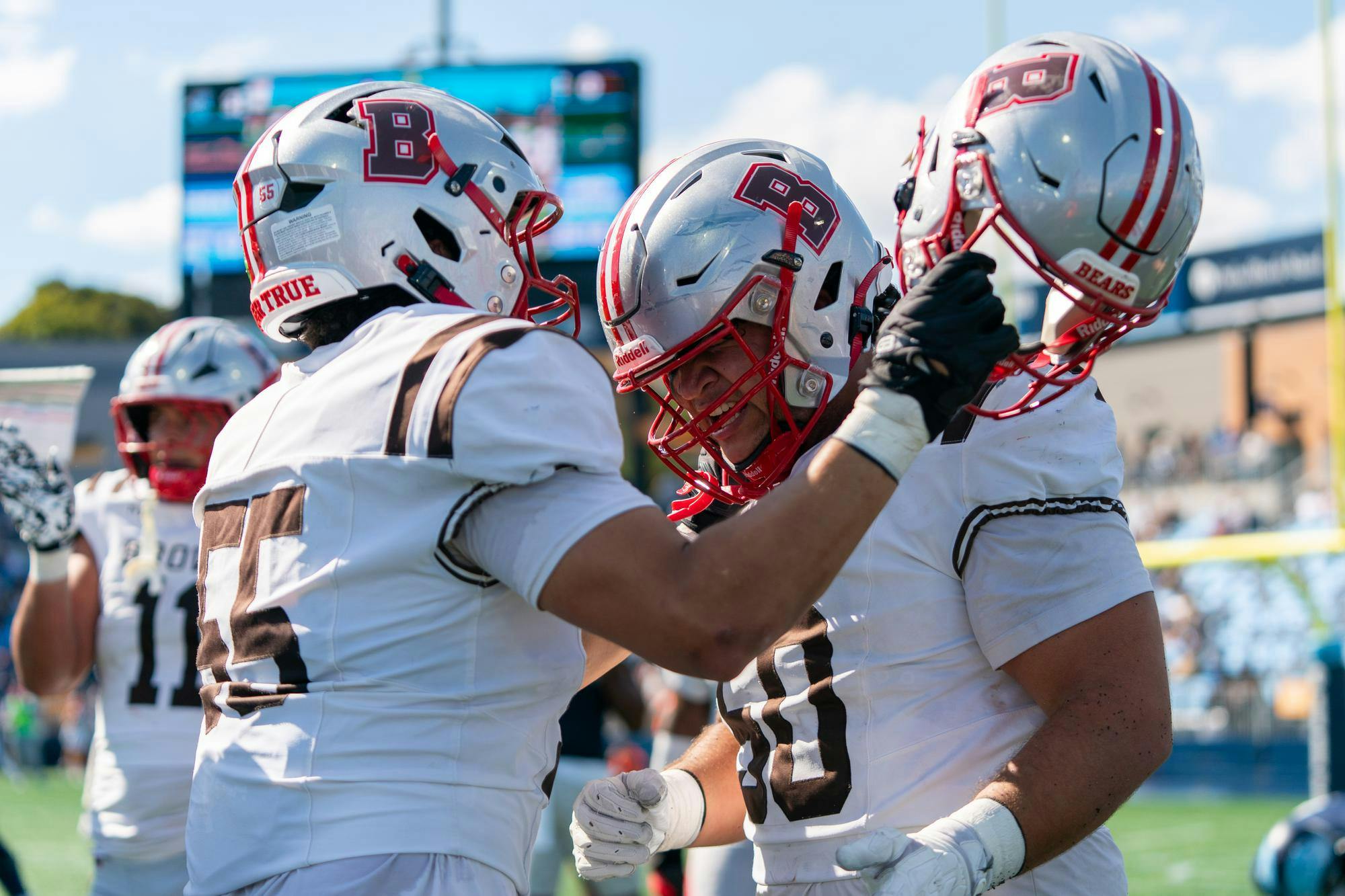 A photo of two Brown football players celebrating. 