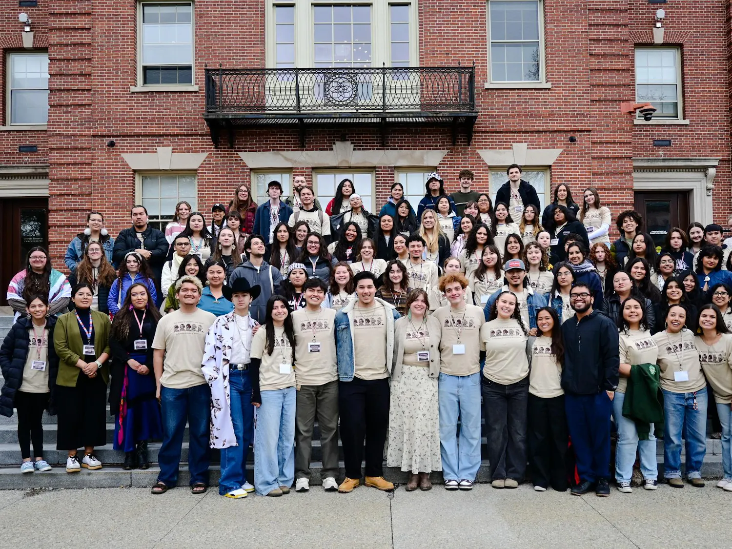 A picture of the attendees at the Ivy Native Conference on the Faunce stairs.