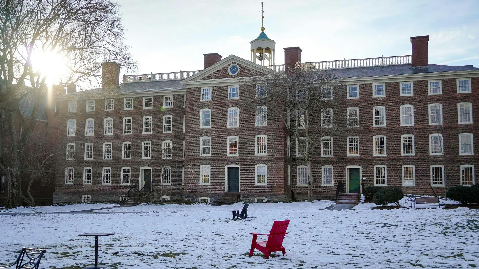 A picture of University Hall in front of a snow-covered Quiet Green