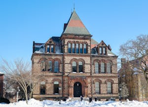 A photo of a large old stone building, Sayles Hall.