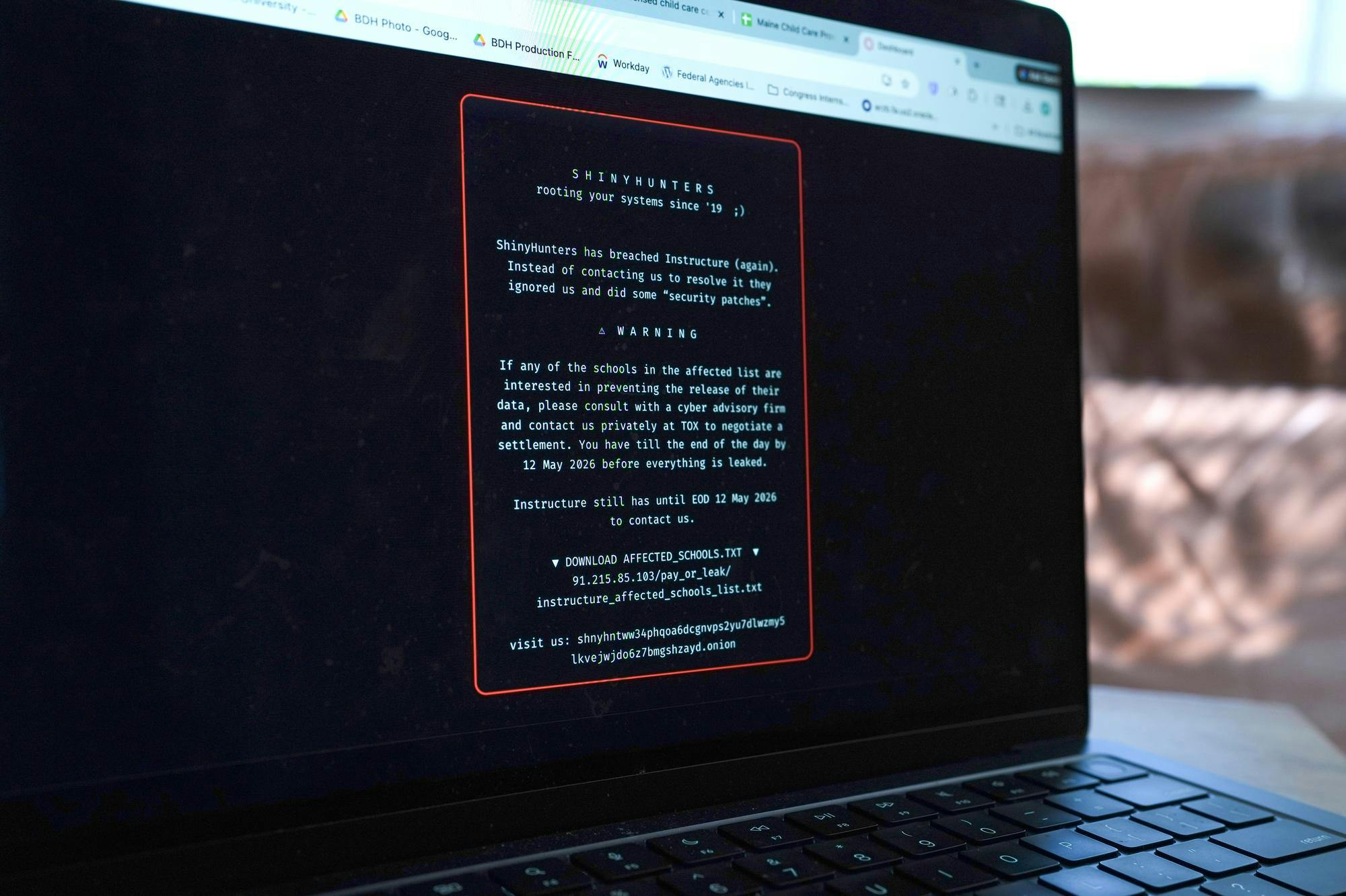 Image of a laptop displaying the ransom note.