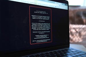 Image of a laptop displaying the ransom note.