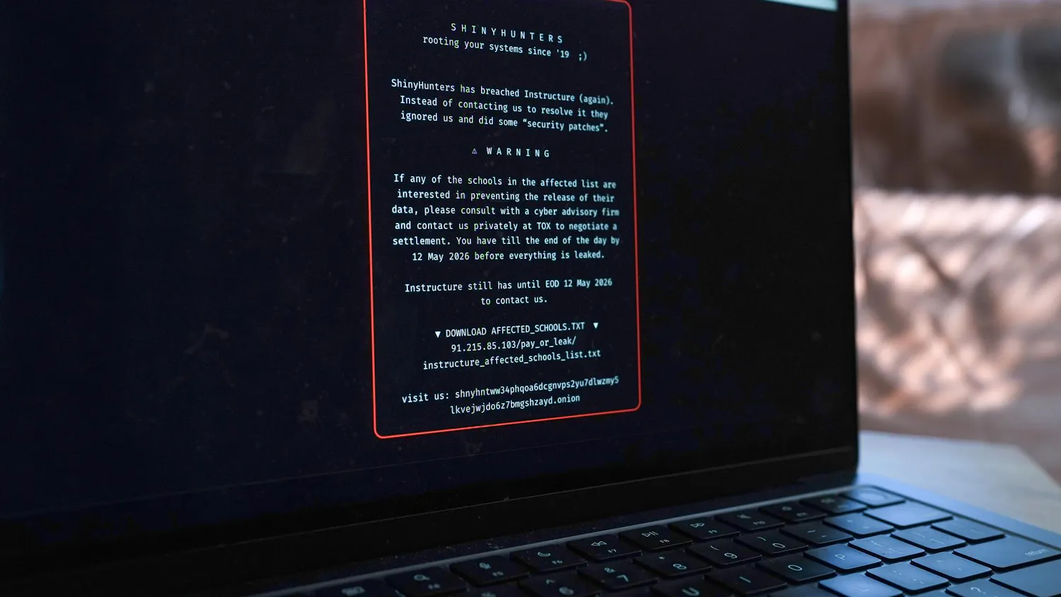 Image of a laptop displaying the ransom note.