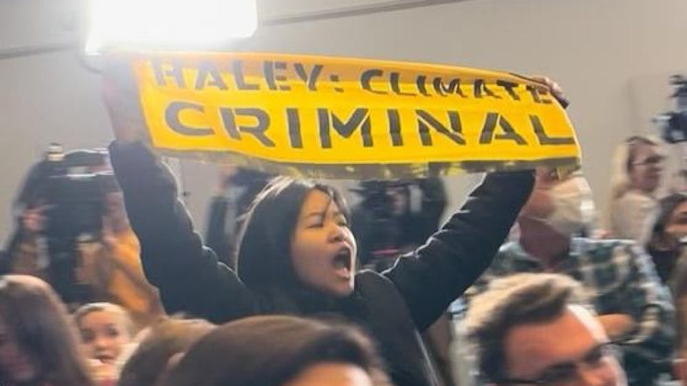 <p>Sunrise members held signs which read “Haley: Climate Criminal” and criticizing Haley’s relationship with the fossil fuel industry. </p><p>Courtesy of Sunrise Brown</p>