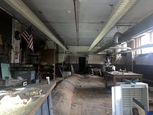 The school’s woodworking shop is in the basement. The floor’s odd shape is a result of years of water damage.
