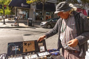 Photo of Jose Ruiz and his jewelry stand