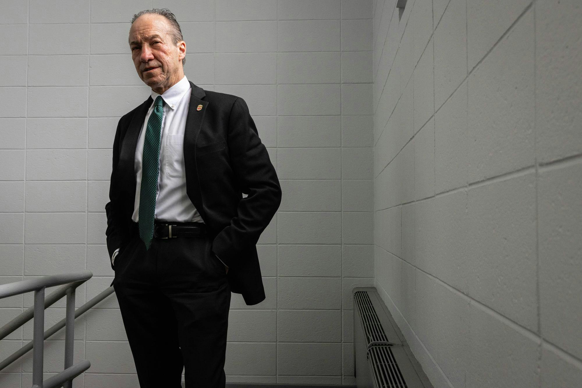 Photo of Hugh Clements in a black suit.

