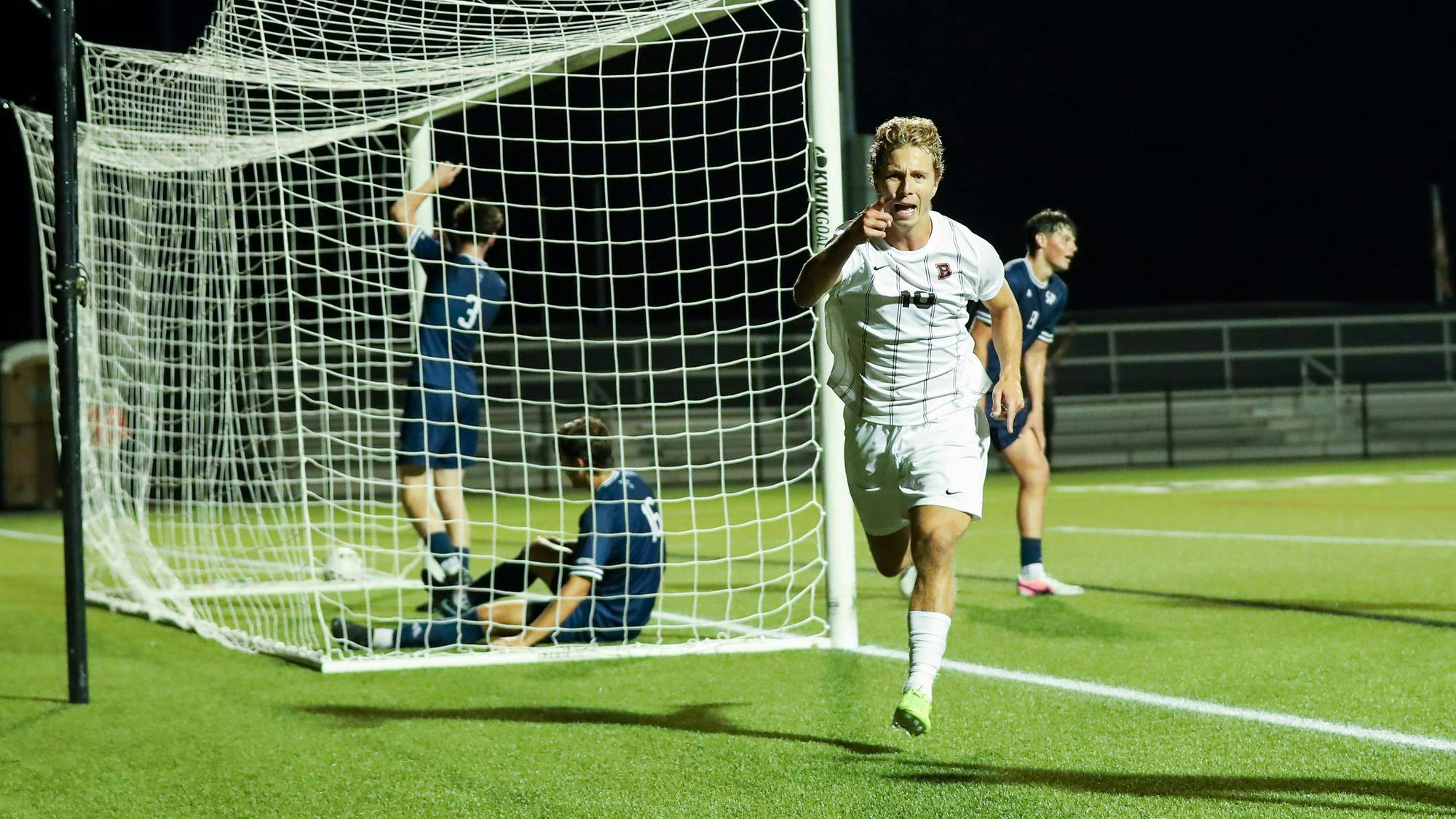 Photo of a Brown Men's Soccer player celebrating after scoring a goal. Courtesy of Brown Athletics