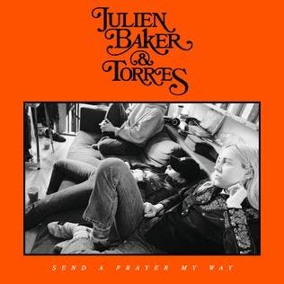The album cover for "Send a Prayer My Way," which features a black and white picture of three people sitting on a couch surrounded by a bright orange border.