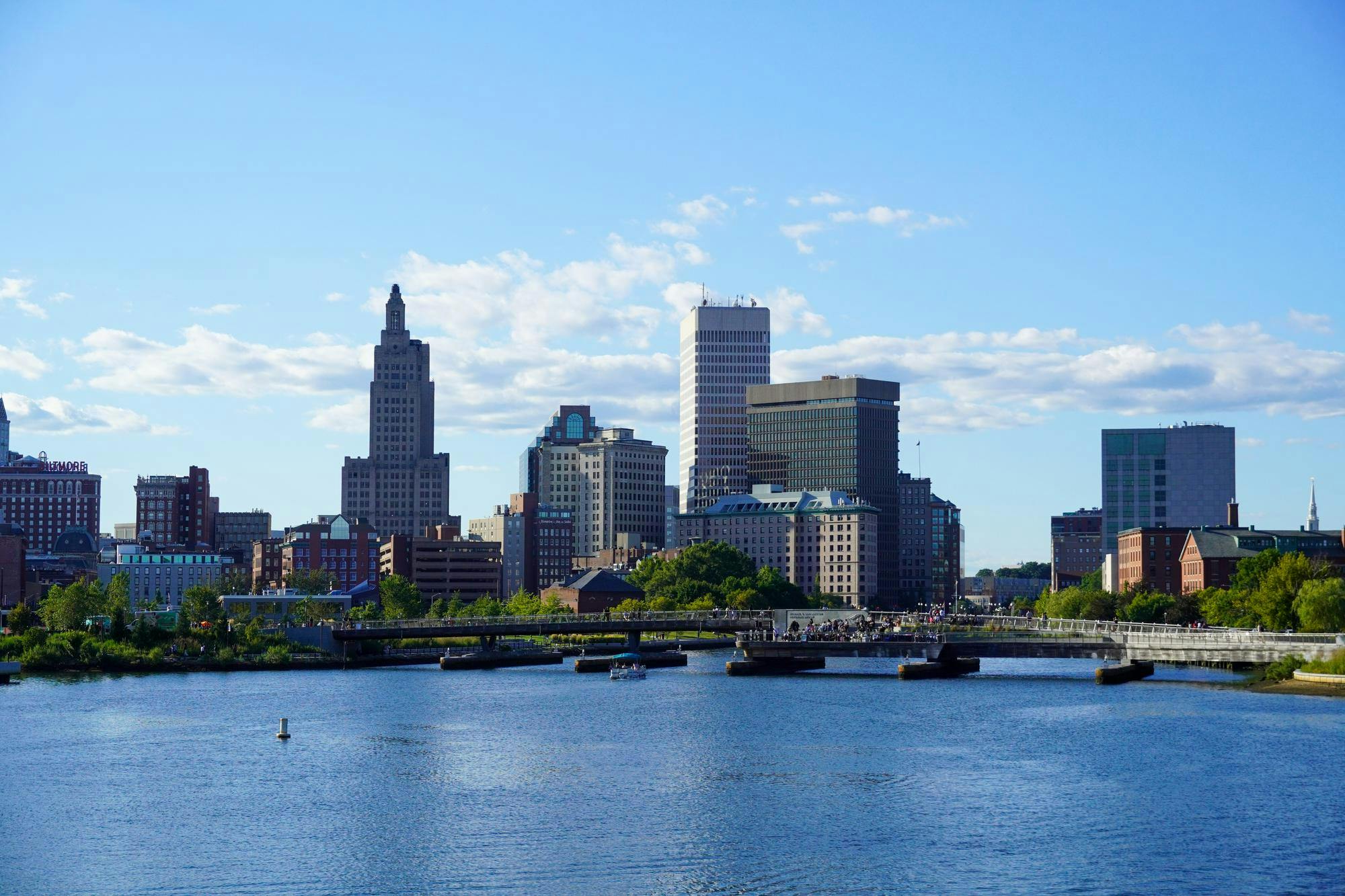 Photo of several large glass buildings making up the Providence skyline.

