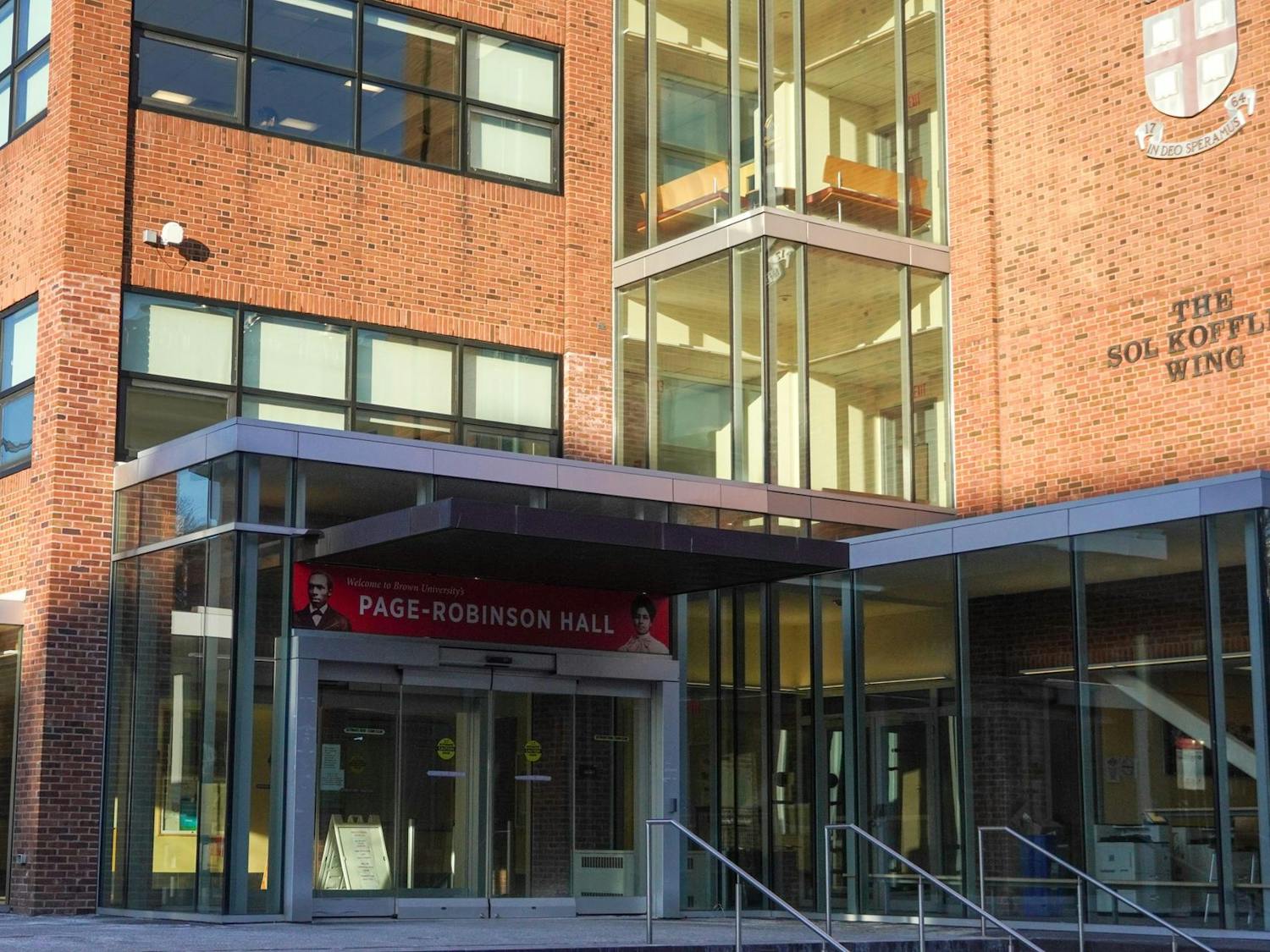 A photo showing the front corner of Page-Robinson Hall with the sun shining on the second through fifth floors.