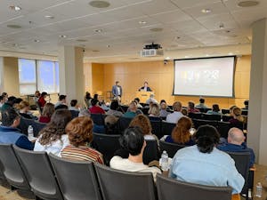 Haifan Lin speaks to a hall of over 50 people at Brown’s 2025 Mac V. Edds Lectureship
